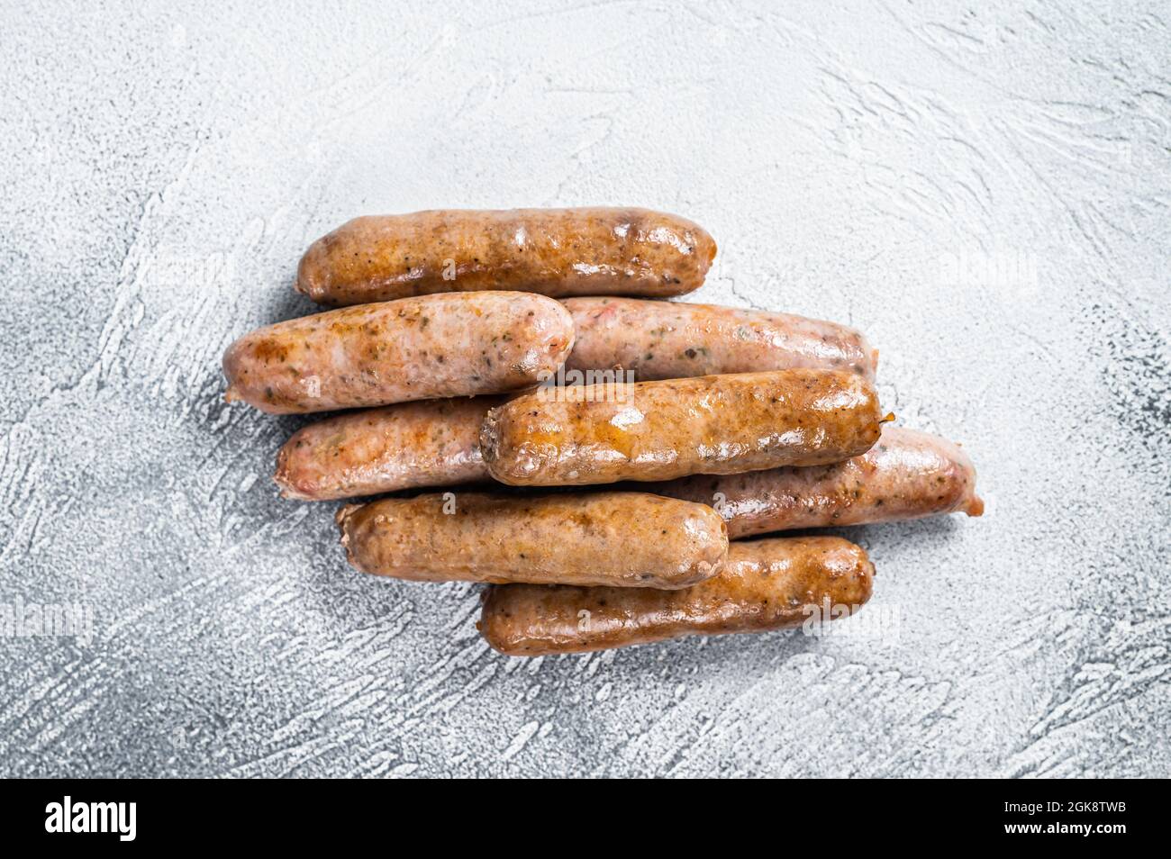 Roasted Bratwurst Hot Dog sausages. White background. Top View Stock Photo