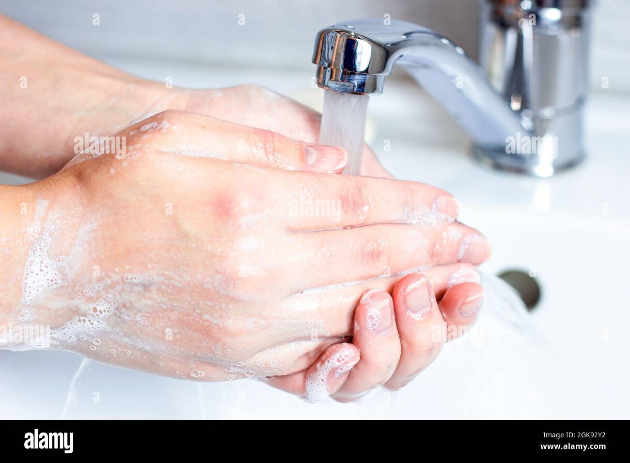 Woman washing white foam in hi-res stock photography and images - Alamy