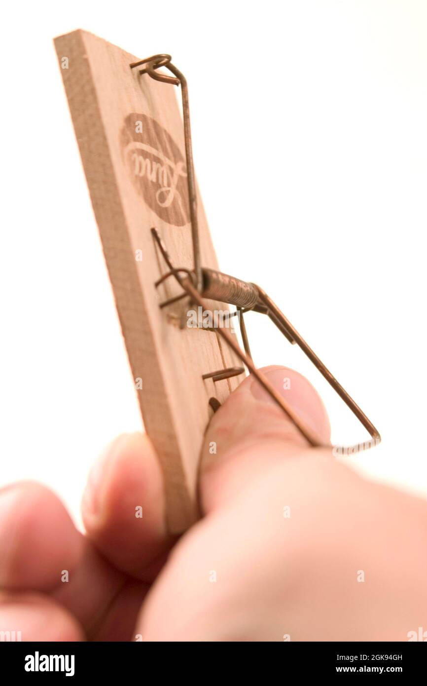 thumb in a mousetrap Stock Photo