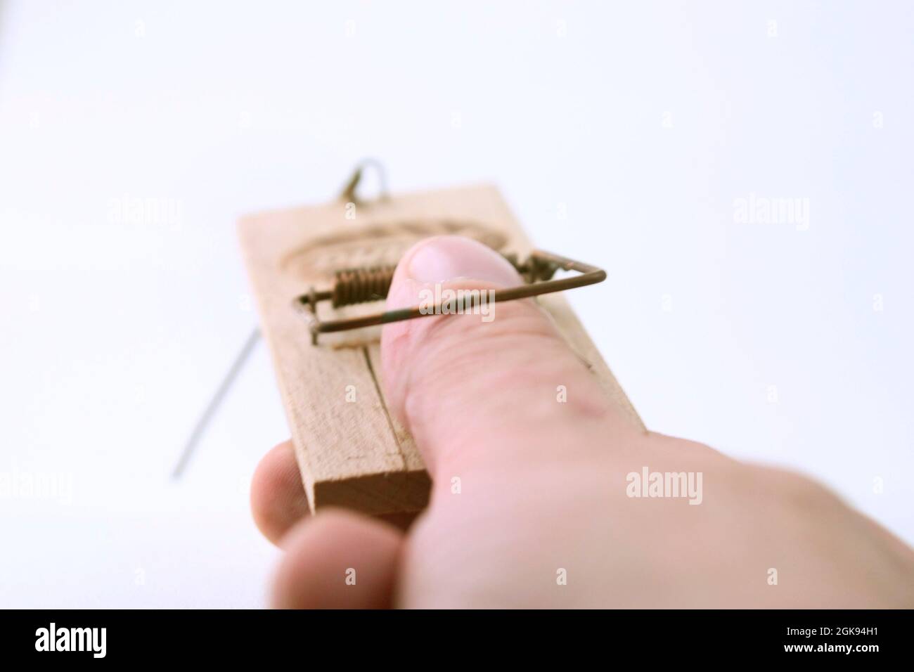 thumb in a mousetrap Stock Photo