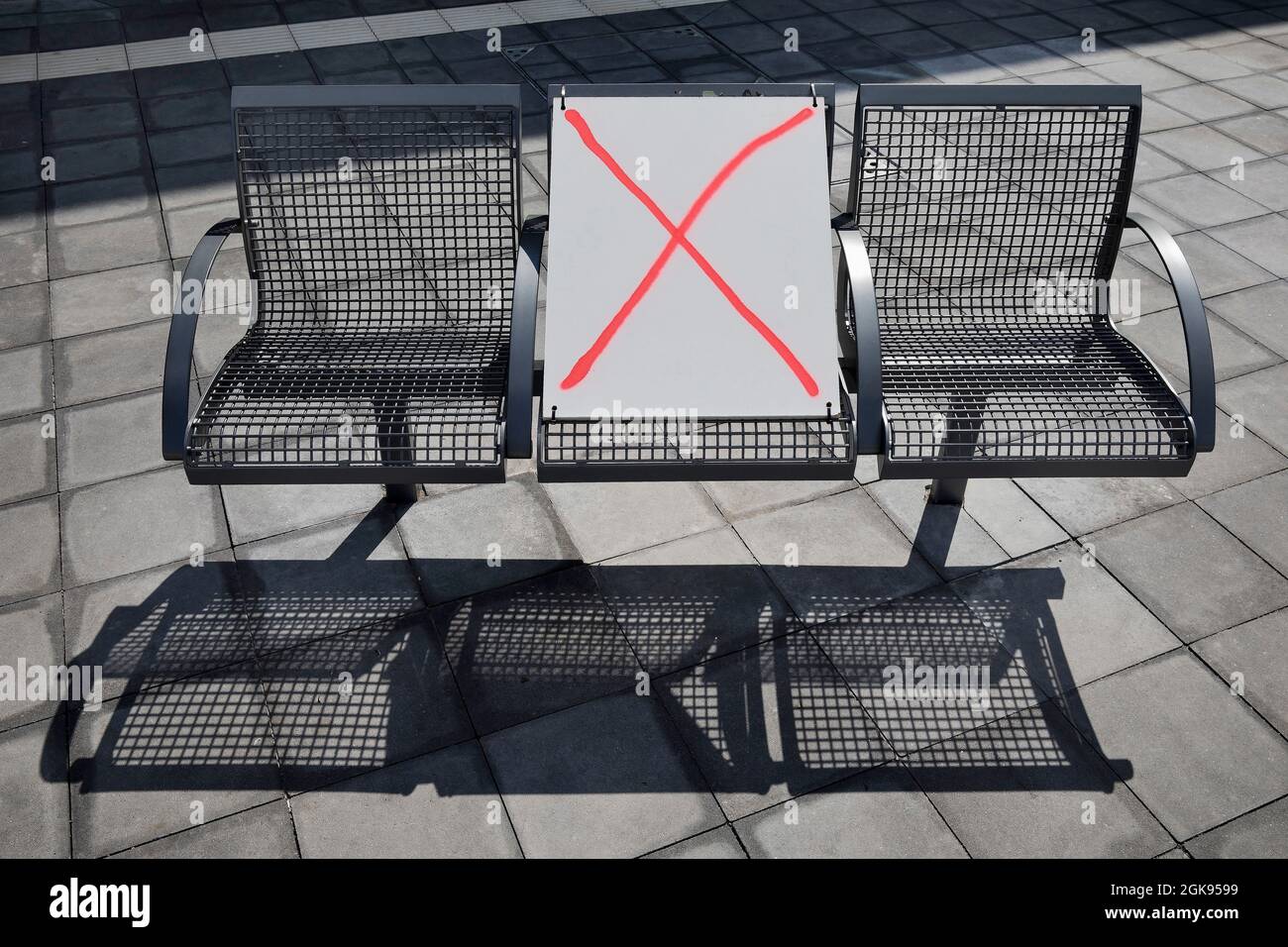 Corona-distancing regulations on a bench in spring 2021, Central bus station, Germany, Berlin Stock Photo