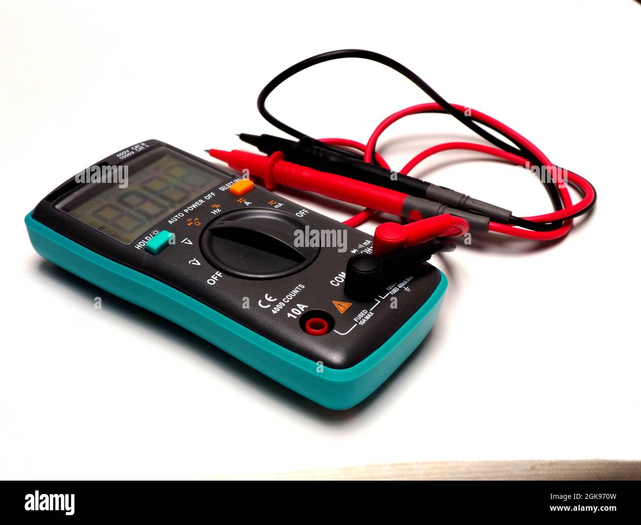Picture of a digital multimeter, with red and black probe. Shoot on a