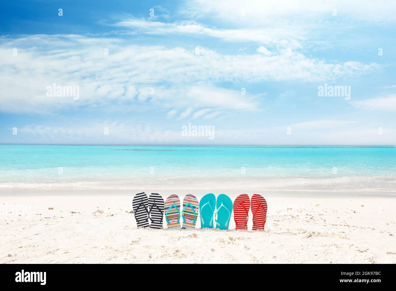 Colorful flip-flops on sea shore. Summer vacation concept Stock Photo ...