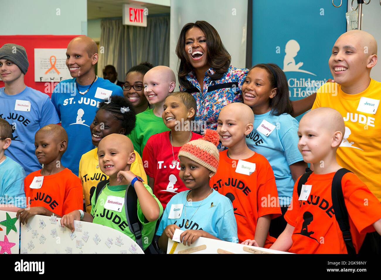 First Lady Michelle Obama joins children for a group photo during a visit to St. Jude Children's Research Hospital in Memphis, Tenn., Sept. 17, 2014. (Official White House Photo by Amanda Lucidon) This official White House photograph is being made available only for publication by news organizations and/or for personal use printing by the subject(s) of the photograph. The photograph may not be manipulated in any way and may not be used in commercial or political materials, advertisements, emails, products, promotions that in any way suggests approval or endorsement of the President, the First Stock Photo