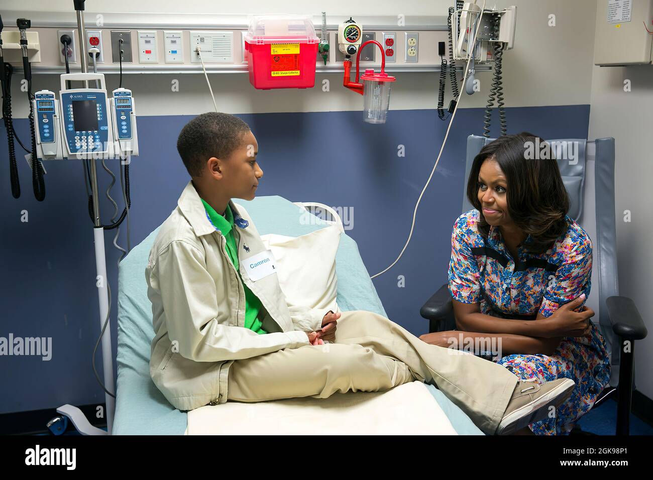 First Lady Michelle Obama visits with Camron Stevens in his room at St. Jude Children's Research Hospital in Memphis, Tenn., Sept. 17, 2014. (Official White House Photo by Amanda Lucidon) This official White House photograph is being made available only for publication by news organizations and/or for personal use printing by the subject(s) of the photograph. The photograph may not be manipulated in any way and may not be used in commercial or political materials, advertisements, emails, products, promotions that in any way suggests approval or endorsement of the President, the First Family, o Stock Photo