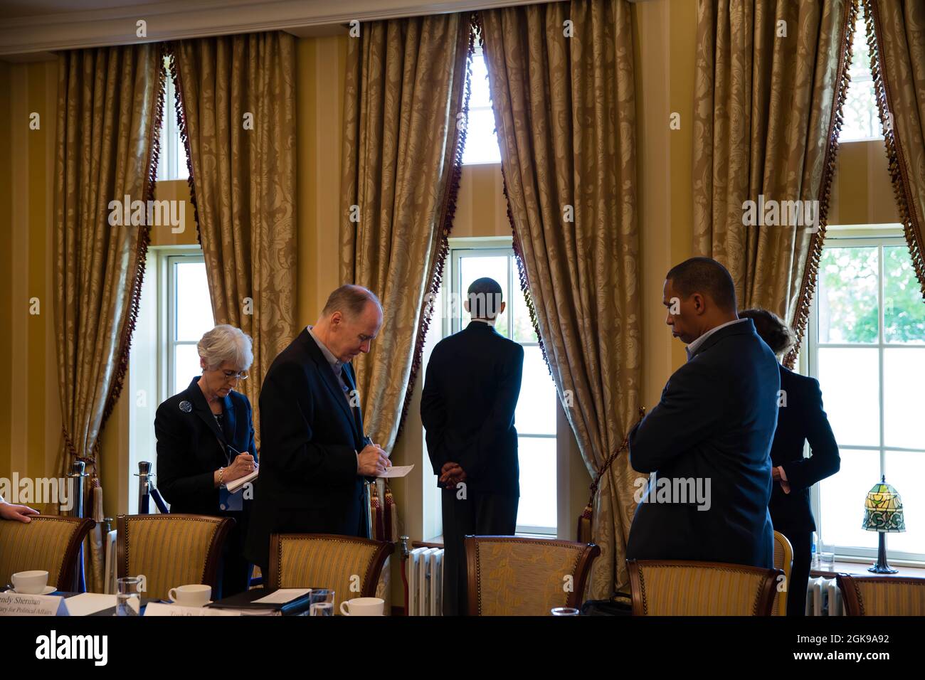 President Barack Obama waits with advisors before a bilateral meeting during the G8 Summit at the Lough Erne Resort in Enniskillen, Northern Ireland, June 18, 2013. Pictured, from left, are: Wendy Sherman, Under Secretary of State for Political Affairs; National Security Advisor Tom Donilon; President Obama; Rob Nabors, Deputy Chief of Staff for Policy; and Caroline Atkinson, Special Assistant to the President for International Economic Affairs. (Official White House Photo by Pete Souza)  This official White House photograph is being made available only for publication by news organizations an Stock Photo
