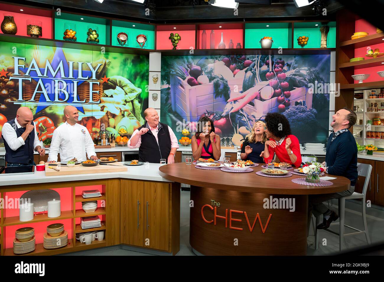 First Lady Michelle Obama tapes a segment of The Chew  in New York, N.Y., Sept. 23, 2014. Participants with the First Lady from left are: Michael Symon, 'Let's Move!' Executive Director Sam Kass, Mario Batali, Daphne Oz, Carla Hall and Clinton Kelly. (Official White House Photo by Chuck Kennedy) This official White House photograph is being made available only for publication by news organizations and/or for personal use printing by the subject(s) of the photograph. The photograph may not be manipulated in any way and may not be used in commercial or political materials, advertisements, emails Stock Photo