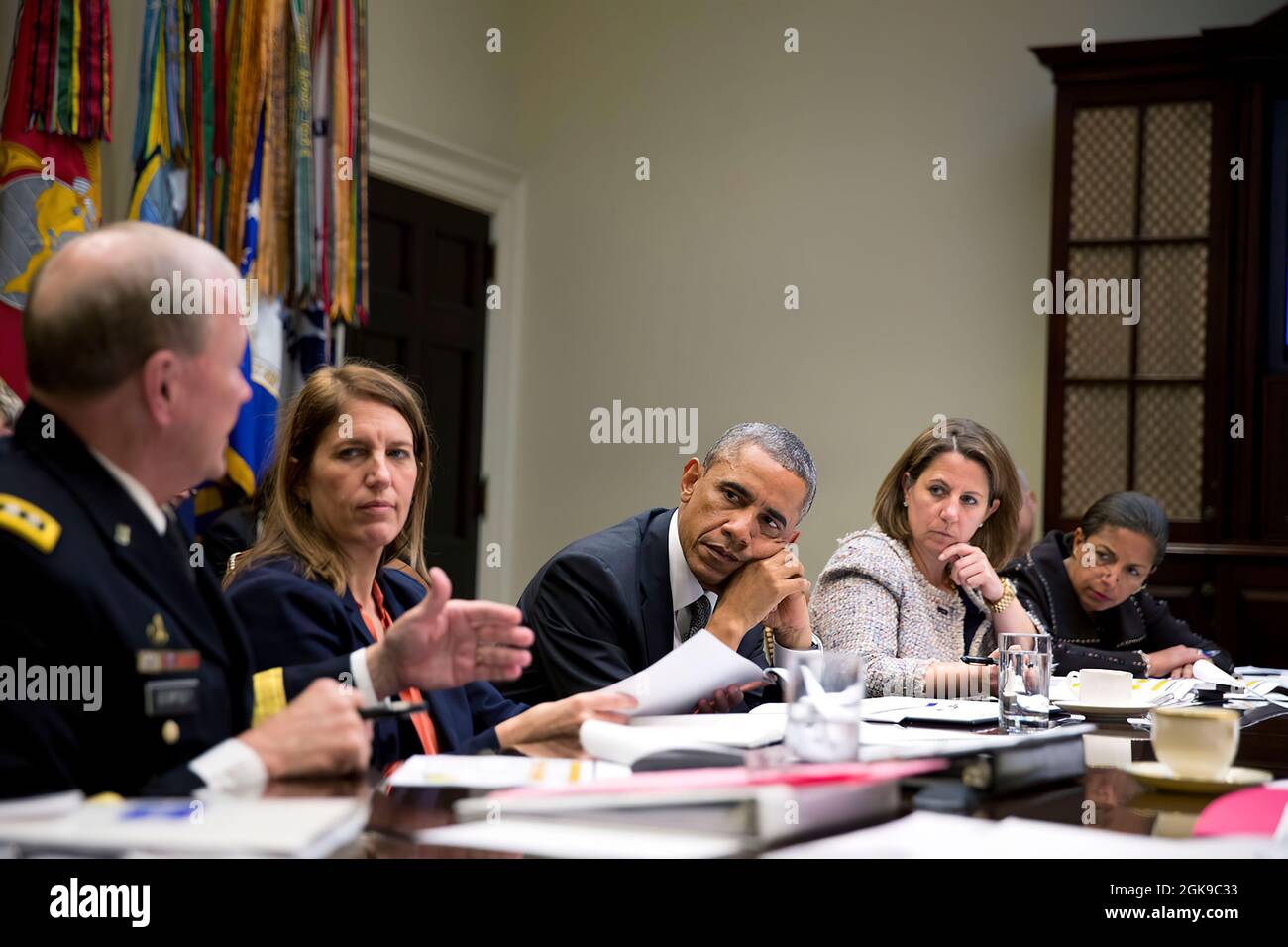 President Barack Obama receives an update on the Ebola outbreak in West Africa and the administration’s response efforts, in the Roosevelt Room of the White House, Oct. 6, 2014. Pictured, from left, are: Gen. Martin Dempsey, Chairman of the Joint Chiefs of Staff; Health and Human Services Secretary Sylvia Mathews Burwell; Lisa Monaco, Assistant to the President for Homeland Security and Counterterrorism; National Security Advisor Susan E. Rice; and Homeland Security Jeh Johnson. (Official White House Photo by Pete Souza) This official White House photograph is being made available only for pub Stock Photo