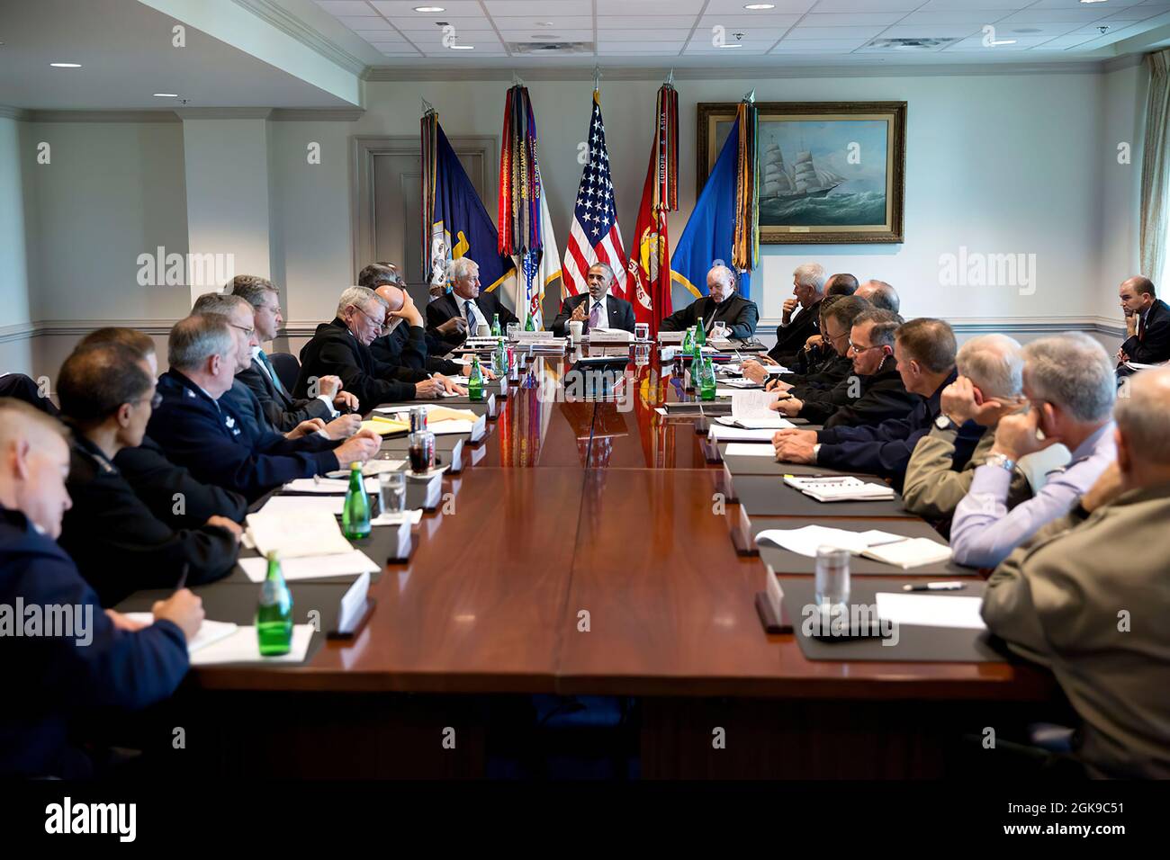 President Barack Obama meets with senior military leadership at the Pentagon in Arlington, Virginia, Oct. 8, 2014. Seated next to the President are Defense Secretary Chuck Hagel and Gen. Martin Dempsey, Chairman of the Joint Chiefs of Staff, right. (Official White House Photo by Pete Souza) This official White House photograph is being made available only for publication by news organizations and/or for personal use printing by the subject(s) of the photograph. The photograph may not be manipulated in any way and may not be used in commercial or political materials, advertisements, emails, pro Stock Photo