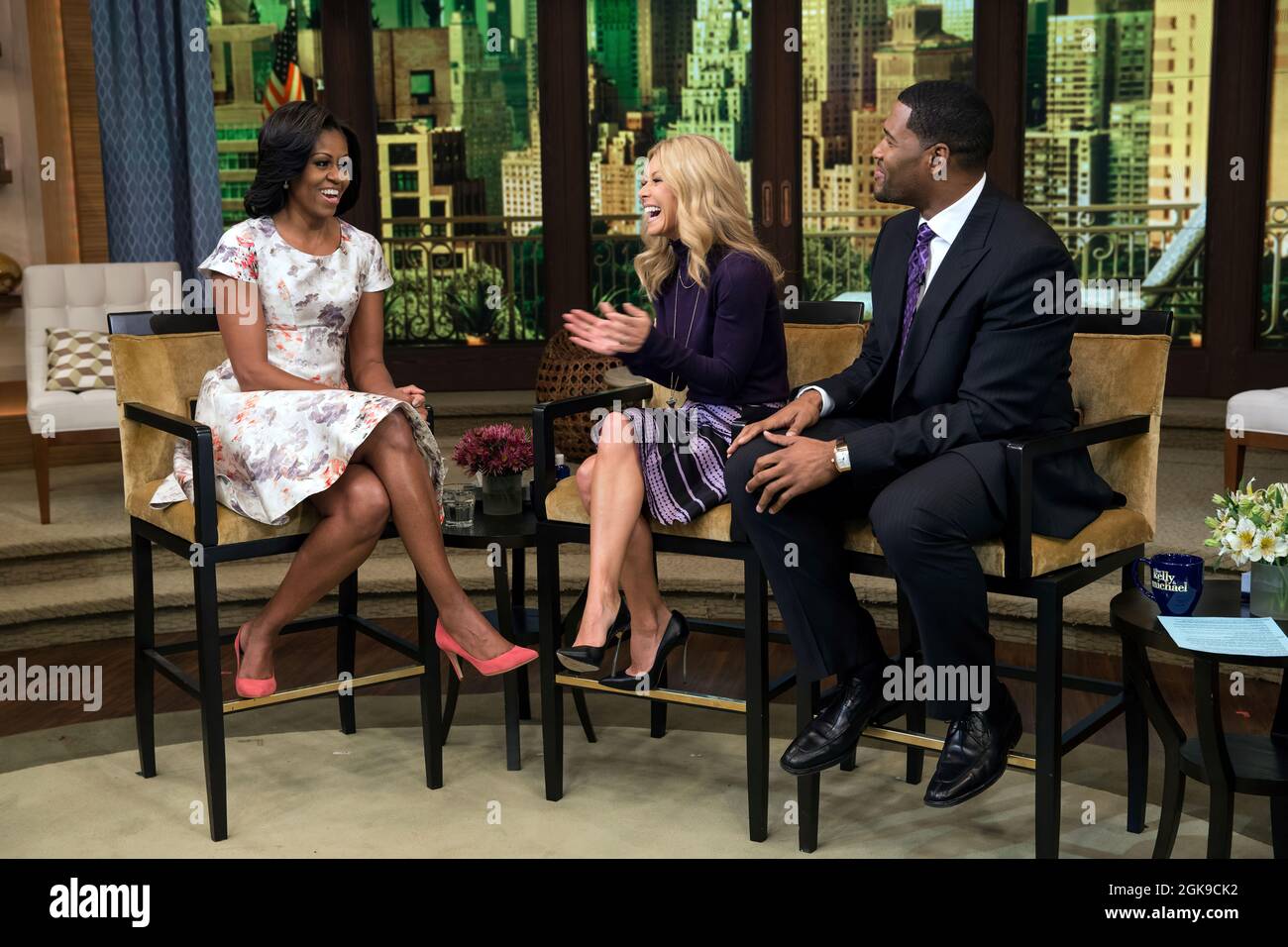 First Lady Michelle Obama participates in a taping with Kelly Ripa and Michael Strahan for 'Live! with Kelly and Michael' at the Live with Kelly Studios in New York, N.Y., Oct. 17, 2012. (Official White House Photo by Sonya N. Hebert) This official White House photograph is being made available only for publication by news organizations and/or for personal use printing by the subject(s) of the photograph. The photograph may not be manipulated in any way and may not be used in commercial or political materials, advertisements, emails, products, promotions that in any way suggests approval or en Stock Photo