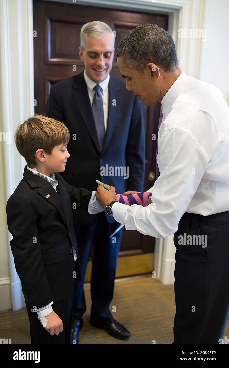 President Barack Obama signs the cast on Chief of Staff Denis McDonough ...