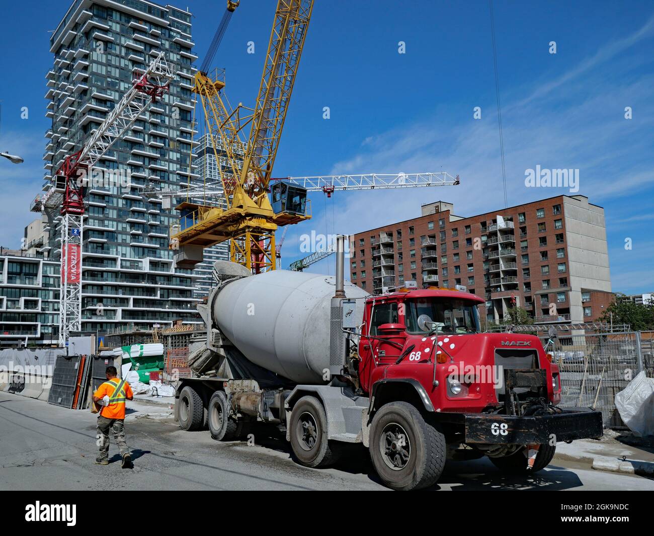 Toronto, Canada - September 13, 2021: A cement truck delivers material for the construction of a new downtown condominium apartment building. Stock Photo