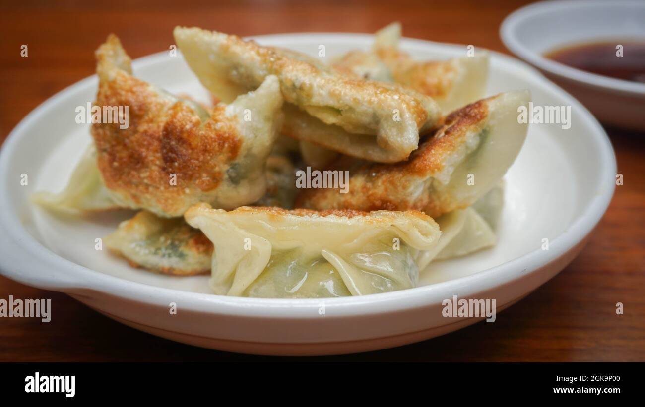 Traditional Chinese homemade pan fried dumpling, vinegar, China Stock