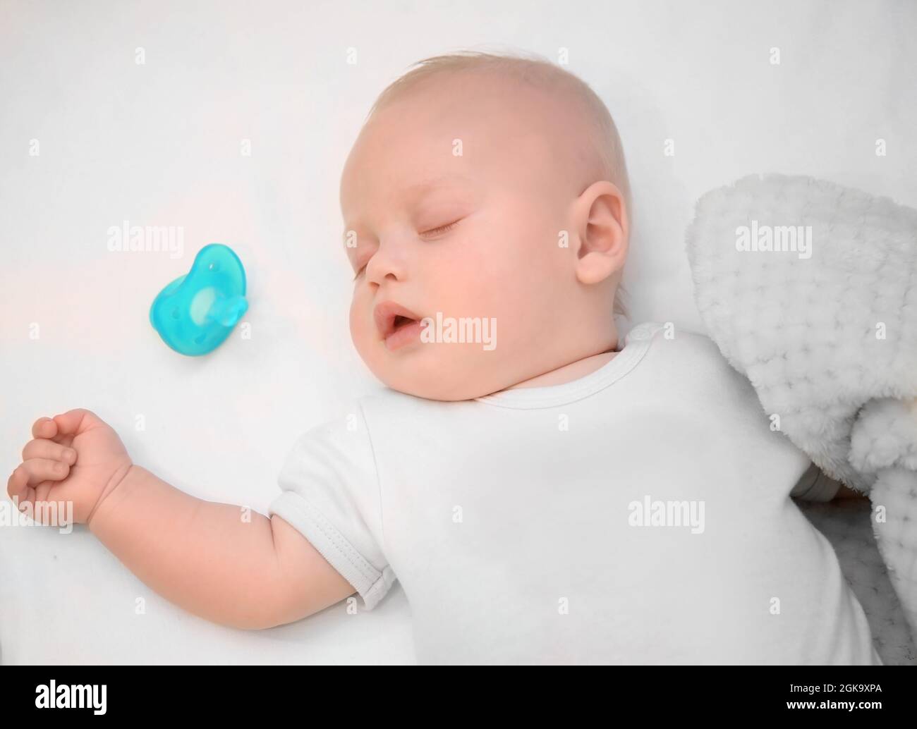 Adorable baby sleeping in cradle at home Stock Photo Alamy