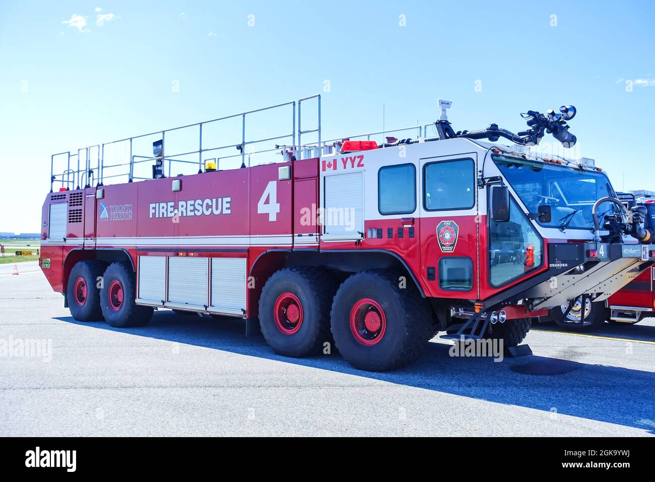 Toronto, Ontario, Canada - June 12, 2016 :  Modern Pierce rescue firetruck at Toronto Pearson Airport against blue sky. Stock Photo