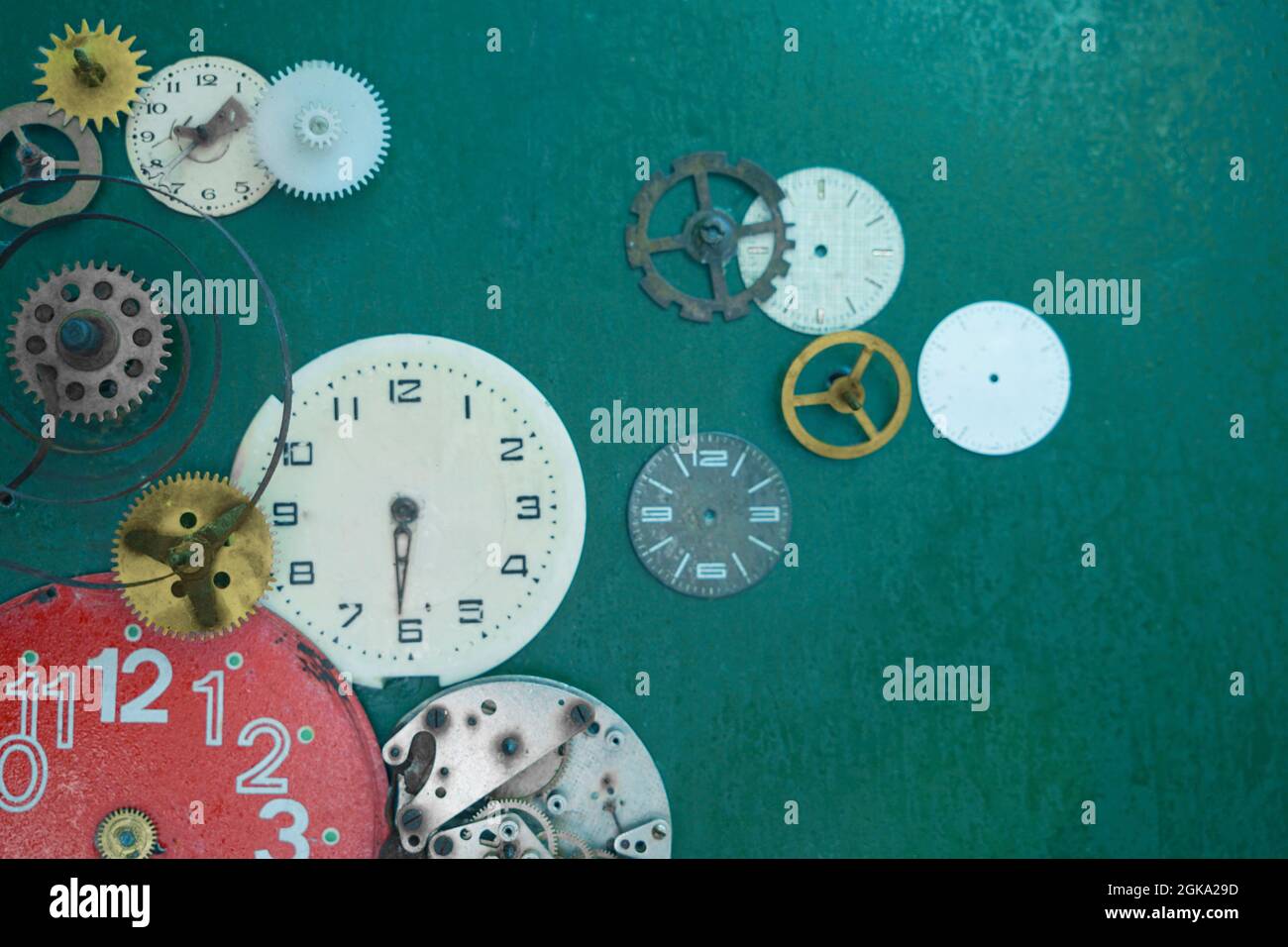 Creative composition with parts of mechanical clock on grunge