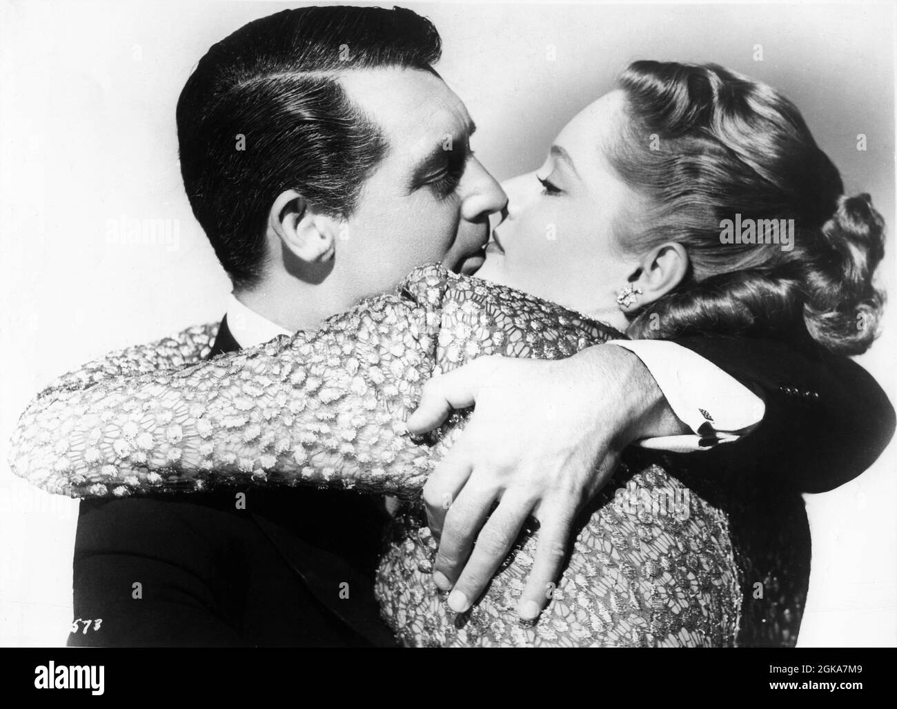 CARY GRANT as composer Cole Porter and ALEXIS SMITH publicity pose for fictionalised biography NIGHT AND DAY 1946 director MICHAEL CURTIZ Warner Bros. Stock Photo