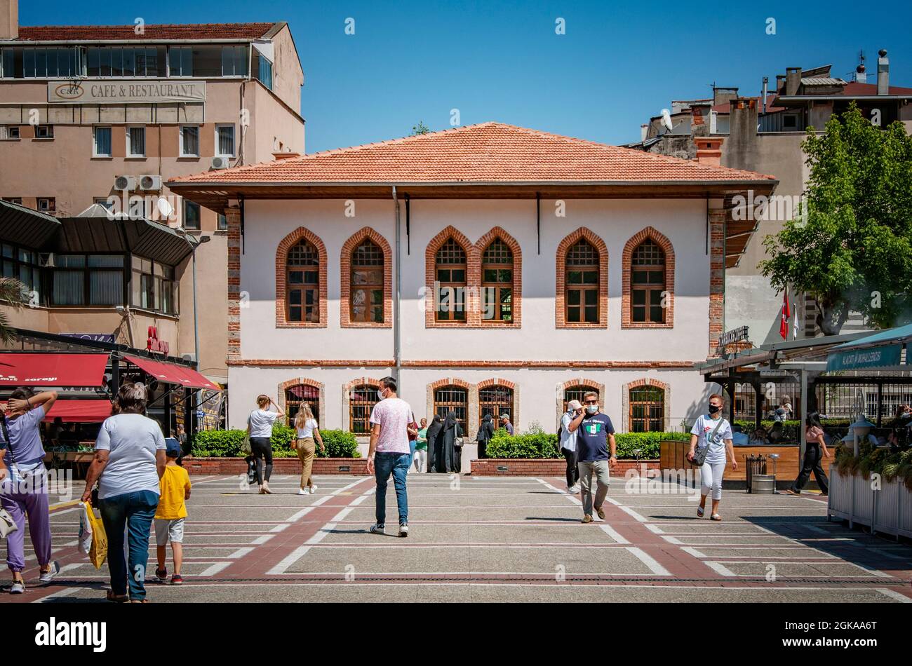 BURSA, TURKEY. AUGUST 15, 2021. Street view, A lot of people on the square. Small shops and cafe. Stock Photo