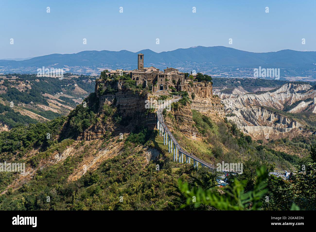 VITERBO ITALY, UK. 13 September, 2021.  Tourists walk on the bridge to Civita di Bagnoregio, a picturesque hilltop village in Italy, is a popular day trip destination from Rome on a hot day. Italian tourism has hit an all-time high during July and August since the according to  the Italian Confederation of Craft Trades and Small and Medium-Sized Enterprises (CNA) with the  rise in travel demand has been attributed to the implementation of the country’s green pass. Credit: amer ghazzal/Alamy Live News Stock Photo