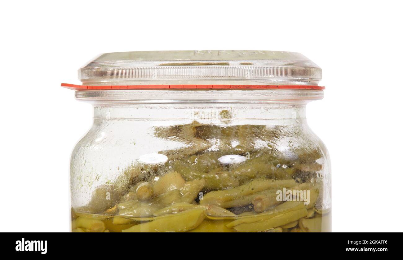 Very old glass jar with green beans, isolated on white Stock Photo - Alamy