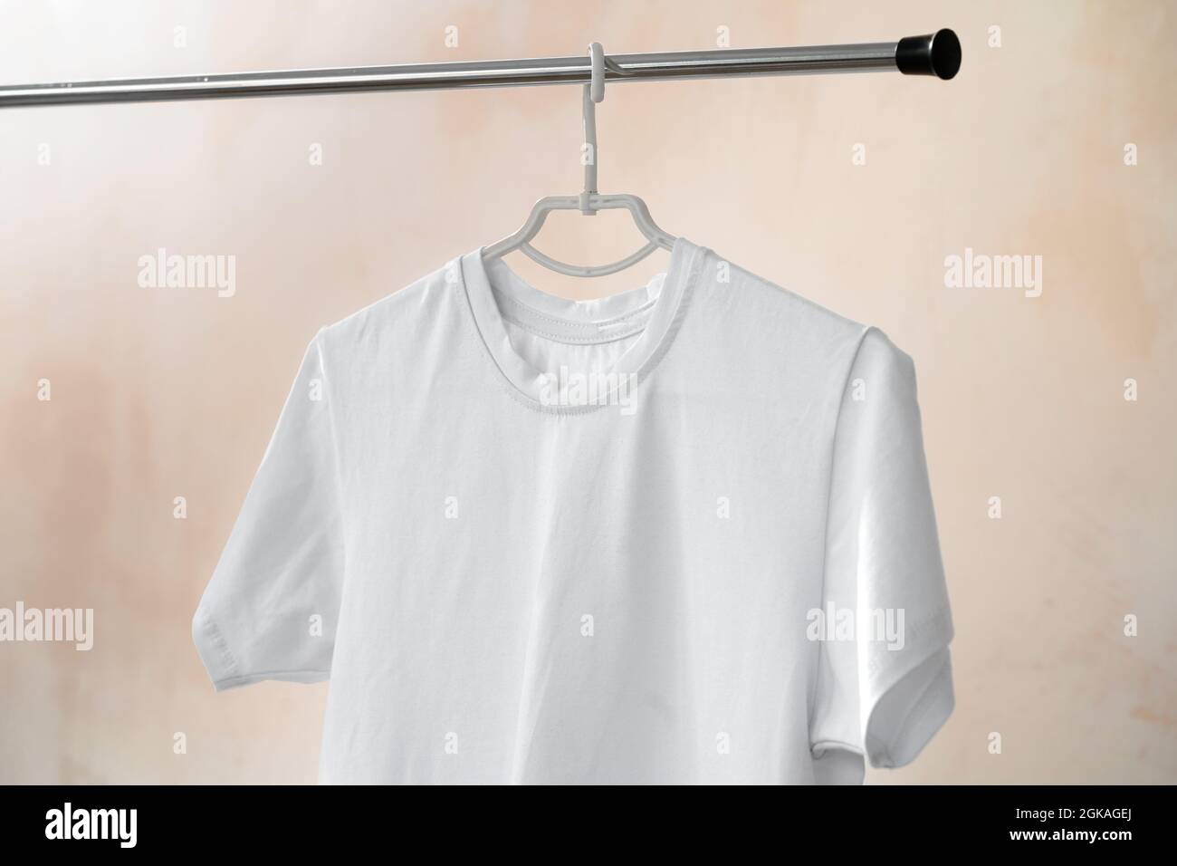 Plain white cotton t-shirt on hanger for your design Stock Photo