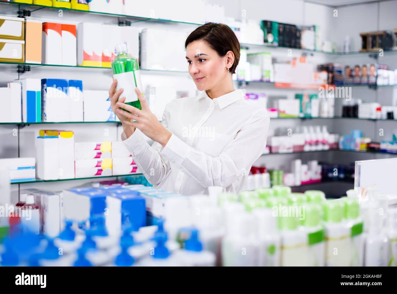 Young woman is searching for body care products Stock Photo - Alamy