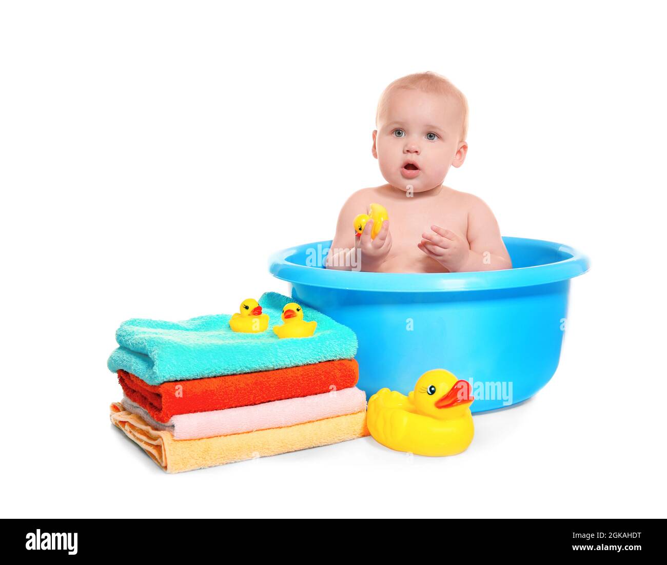 Cute baby washing in bath basin on white background Stock Photo - Alamy