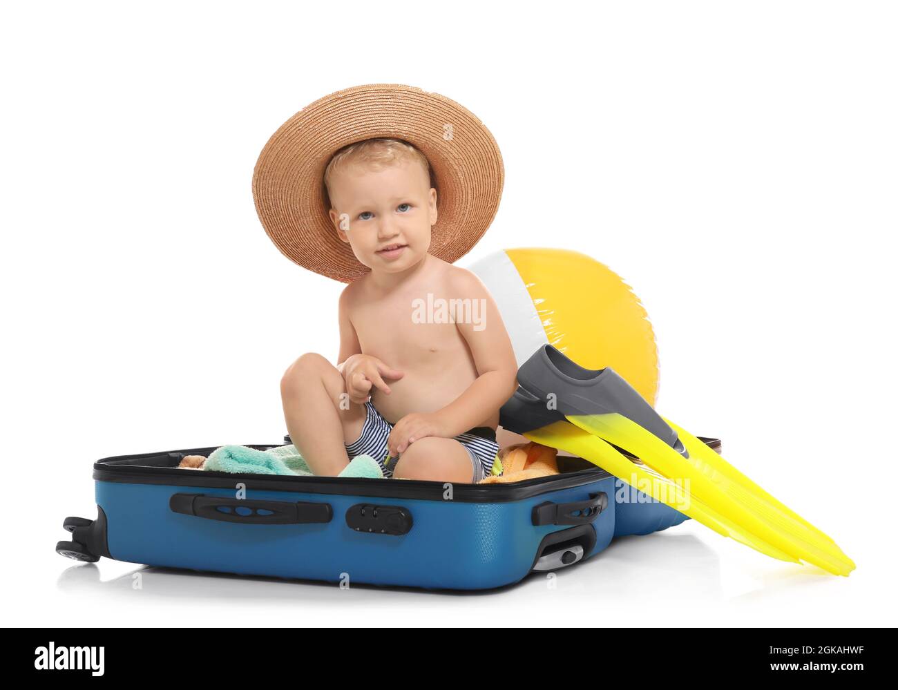 Adorable little boy sitting in suitcase isolated on white Stock Photo Alamy