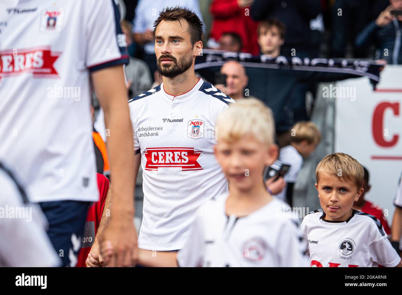 Aarhus, Denmark. 12th, September 2021. Oliver Lund (15) of AGF enters the pitch for the 3F Superliga match between Aarhus GF and Vejle Boldklub at Ceres Park in Aarhus. (Photo credit: Gonzales Photo - Morten Kjaer). Stock Photo