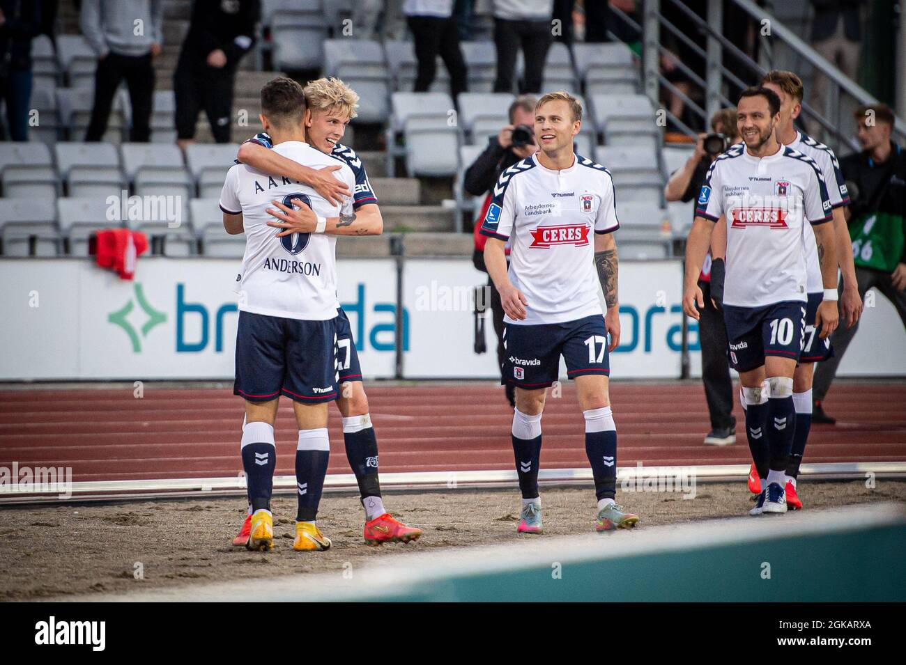 Aarhus, Denmark. 12th, September 2021. Mikael Anderson (8) of AGF scores for 1-0 and celebrates with Albert Gronbaek (27) during the 3F Superliga match between Aarhus GF and Vejle Boldklub at Ceres Park in Aarhus. (Photo credit: Gonzales Photo - Morten Kjaer). Stock Photo