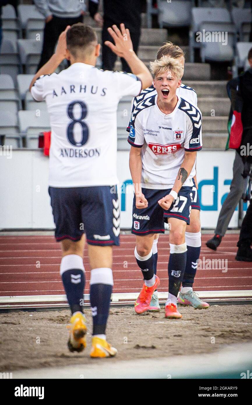 Aarhus, Denmark. 12th, September 2021. Mikael Anderson (8) of AGF scores for 1-0 and celebrates with Albert Gronbaek (27) during the 3F Superliga match between Aarhus GF and Vejle Boldklub at Ceres Park in Aarhus. (Photo credit: Gonzales Photo - Morten Kjaer). Stock Photo