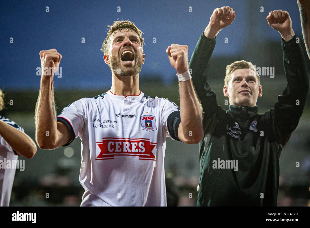 Aarhus, Denmark. 12th, September 2021. Patrick Mortensen (9) of AGF is celebrating the victory with the fans after the 3F Superliga match between Aarhus GF and Vejle Boldklub at Ceres Park in Aarhus. (Photo credit: Gonzales Photo - Morten Kjaer). Stock Photo