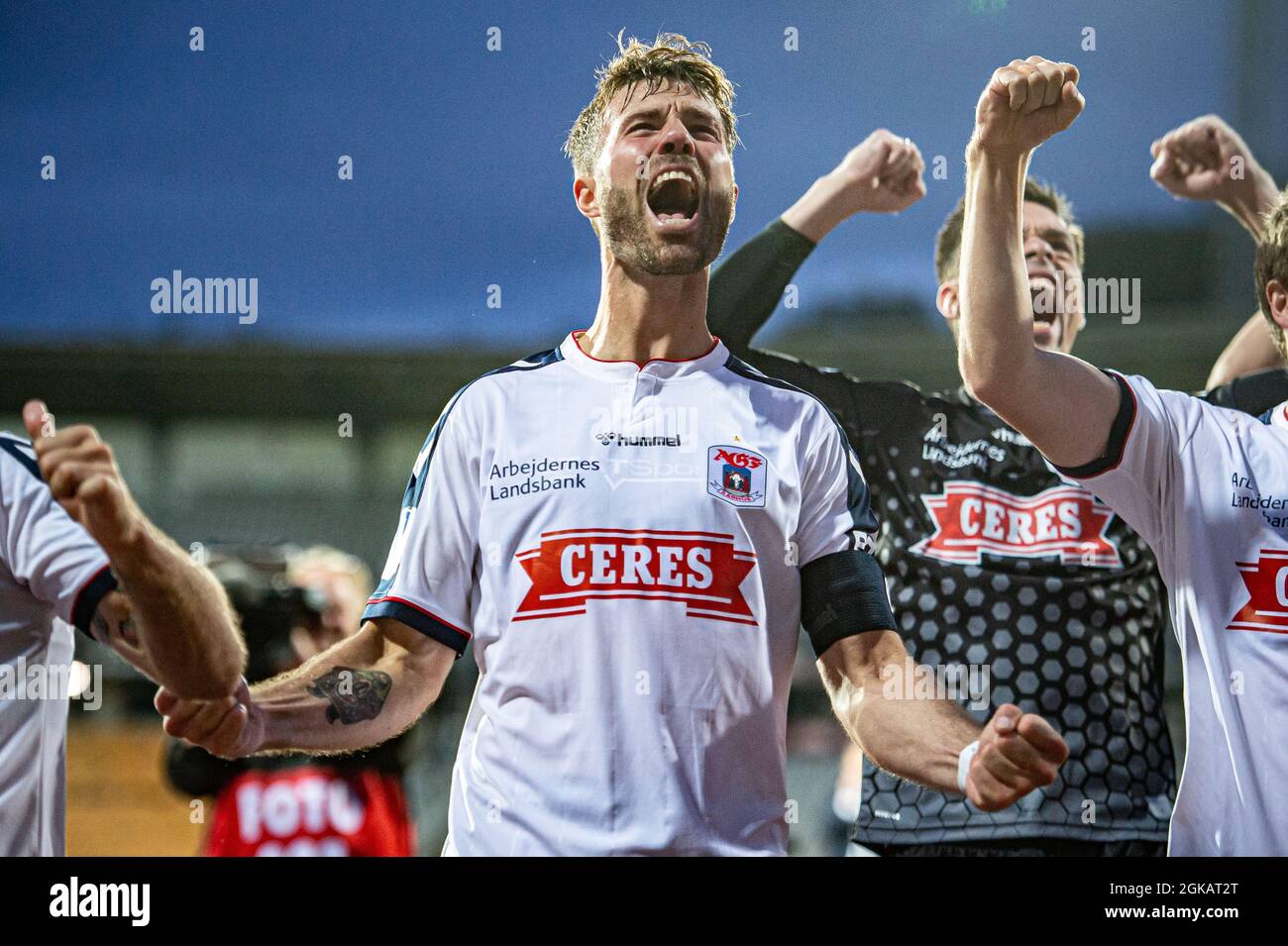 Aarhus, Denmark. 12th, September 2021. Patrick Mortensen (9) of AGF is celebrating the victory with the fans after the 3F Superliga match between Aarhus GF and Vejle Boldklub at Ceres Park in Aarhus. (Photo credit: Gonzales Photo - Morten Kjaer). Stock Photo