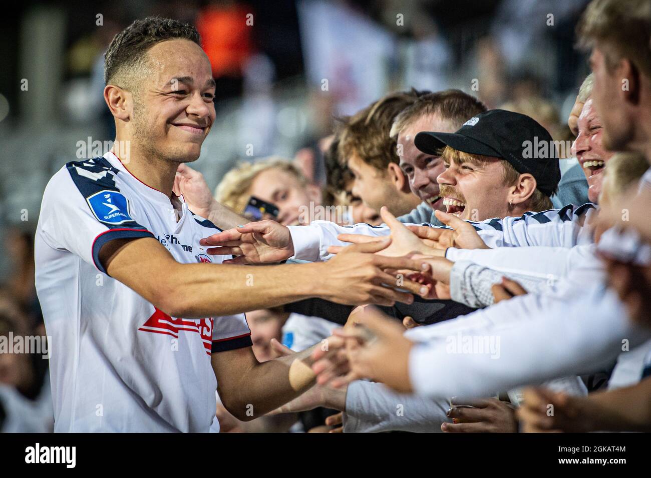 Aarhus, Denmark. 12th, September 2021. Mikael Anderson (8) of AGF celebrates the victory after 3F Superliga match between Aarhus GF and Vejle Boldklub at Ceres Park in Aarhus. (Photo credit: Gonzales Photo - Morten Kjaer). Stock Photo