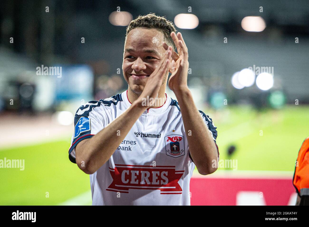 Aarhus, Denmark. 12th, September 2021. Mikael Anderson (8) of AGF celebrates the victory after 3F Superliga match between Aarhus GF and Vejle Boldklub at Ceres Park in Aarhus. (Photo credit: Gonzales Photo - Morten Kjaer). Stock Photo