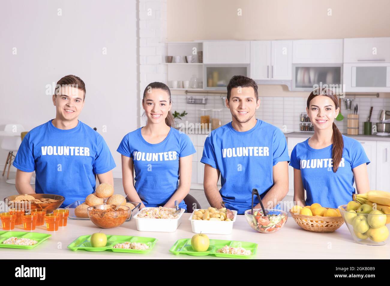 Team of teen volunteers ready for serving food to homeless people in ...