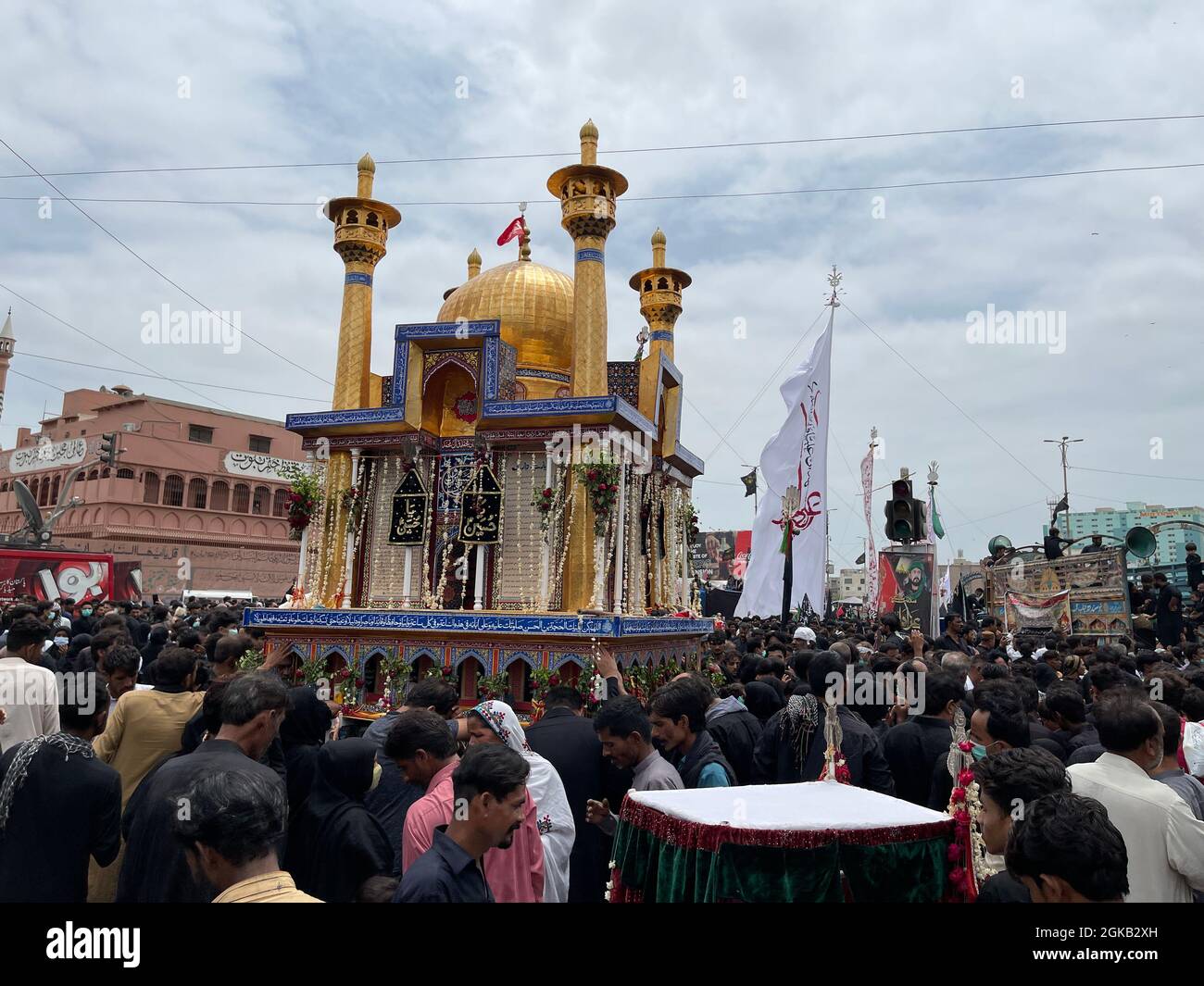 Devotees of Imam Hussain are holding mourning procession in connection of 10th Muharram-ul-Haram, passing through M A jinnah Road Stock Photo