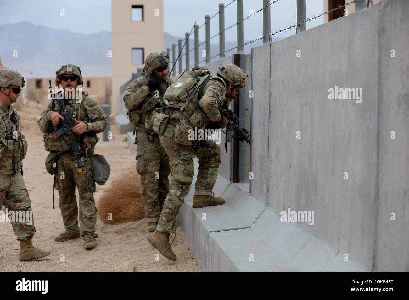 Soldiers with the 45th Infantry Brigade Combat Team, invade a mock ...