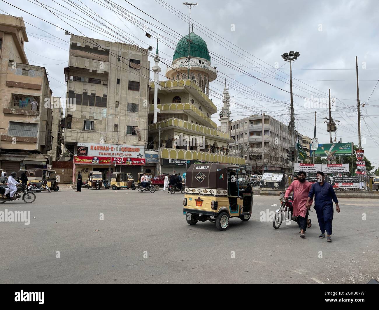 Traffic Passing through Kanzul Iman Mosque. Guru Mandir Karachi Stock Photo