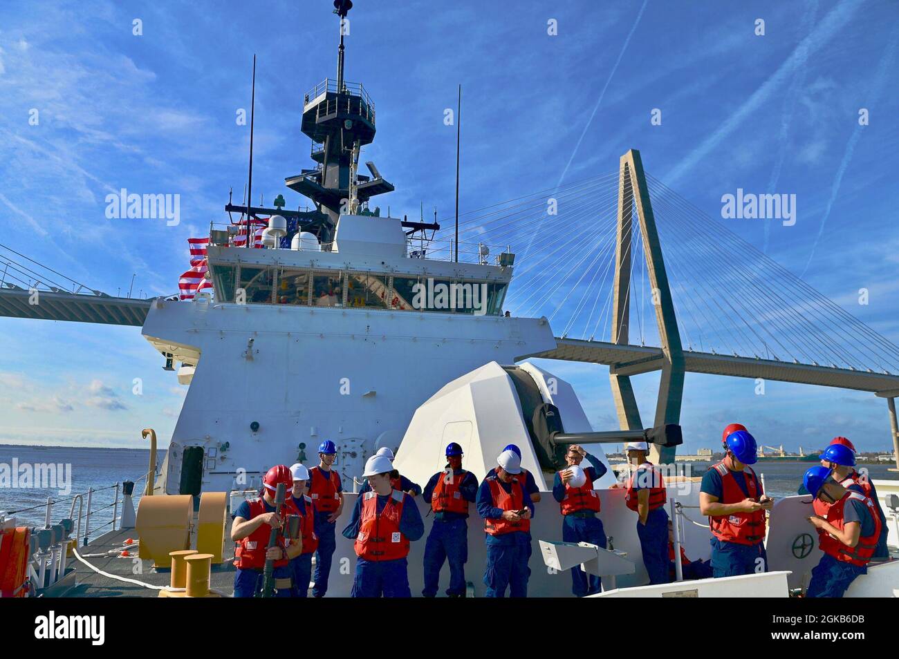 Crew aboard the USCGC Stone (WMSL 758) pass under the Arthur Ravenel Jr