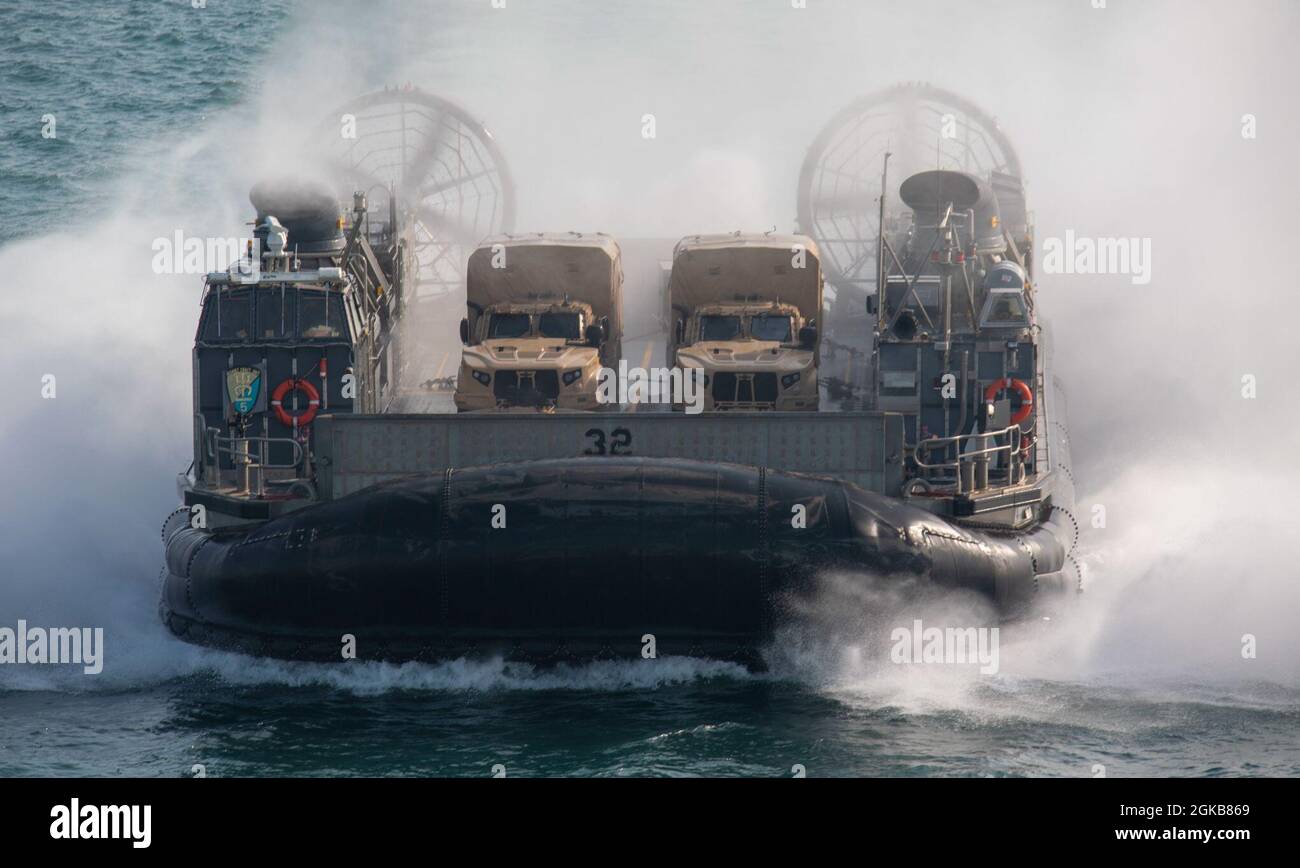 ARABIAN GULF (Mar. 2, 2021) – A U.S. Navy landing craft, air cushion, assigned to Assault Craft Unit (ACU) 5, approaches the well deck of the amphibious assault ship USS Makin Island (LHD 8). The Makin Island Amphibious Ready Group and the 15th Marine Expeditionary Unit are deployed to the U.S. 5th Fleet area of operations in support of naval operations to ensure maritime stability and security in the Central Region, connecting the Mediterranean and the Pacific through the western Indian Ocean and three strategic choke points. Stock Photo