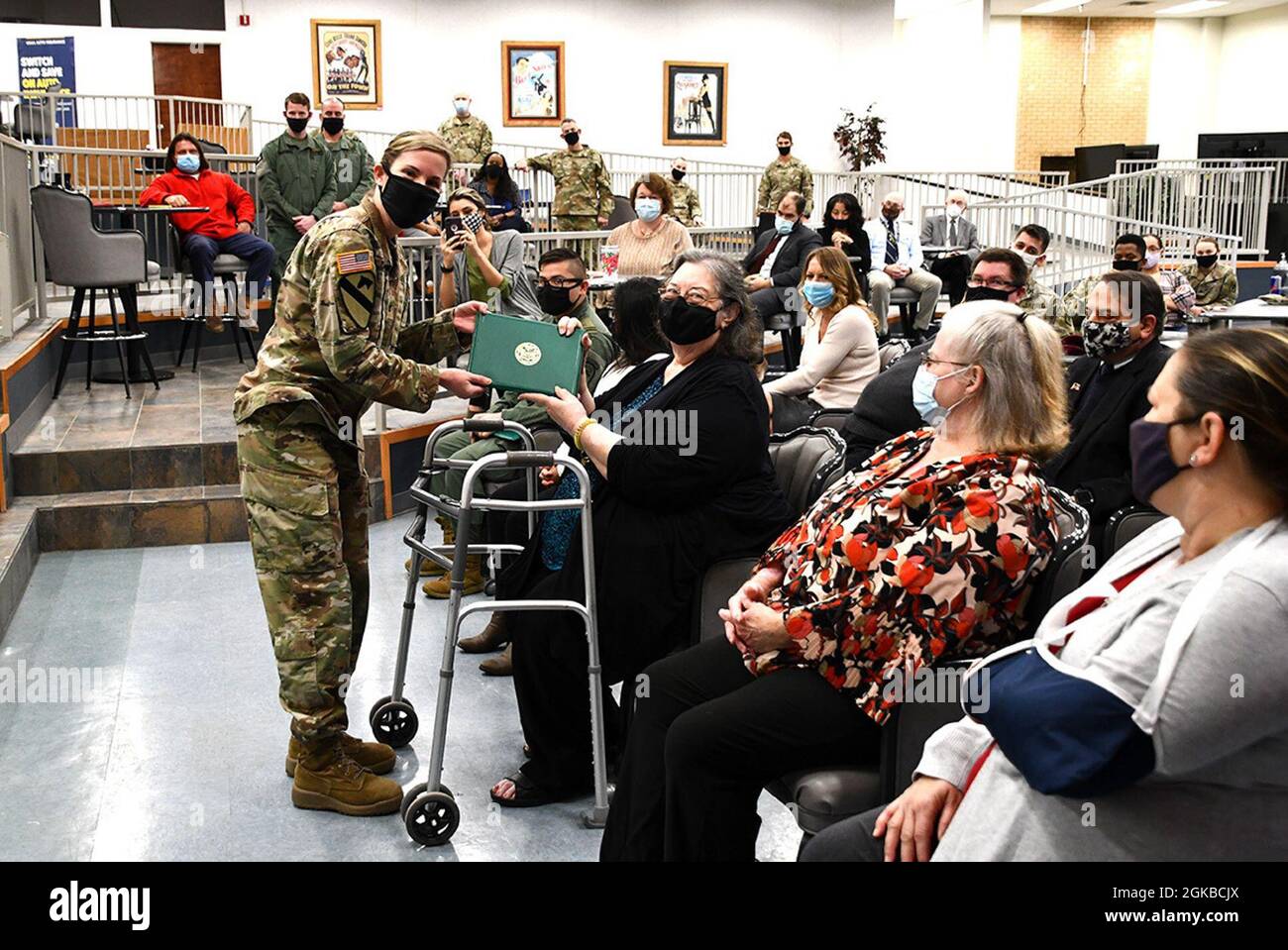 Col. Tiffany Chapman, Fort Polk staff judge advocate, presents Phyllis