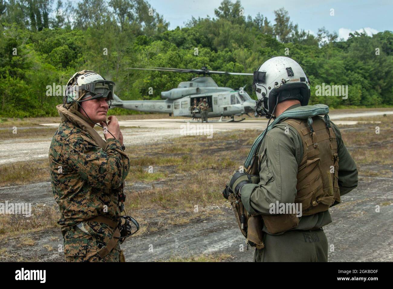 U.S. Marine Corps Col. Michael Nakonieczny, 31st Marine Expeditionary Unit (MEU) commanding officer, prepares to board a UH-1Y Huey with Marine Medium Tiltrotor Squadron 262 (Reinforced), on an airstrip on the Island of Peleliu, Republic of Palau, March 3, 2021. The 31st MEU is operating aboard ships of the Amphibious Squadron 11 in the 7th fleet area of operations to enhance interoperability with allies and partners and serve as a ready response force to defend peace and stability in the Indo-Pacific region. Stock Photo