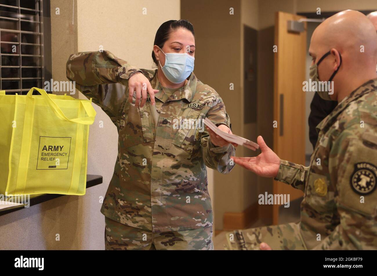 AER representative Sgt. 1st Class Natasha Hogan hands out contribution slips for Soldiers to take back to their units in hopes of receiving donations to the 2021 campaign. Funds raised go directly to service members and their Families for emergency relief and education scholarships. Stock Photo
