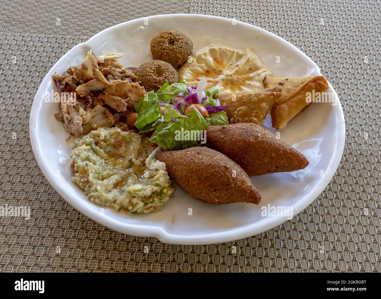typical Arab food, dish with varied elaborations, zambuzak, falafel, mutabal, hummus, halal, shawarm Stock Photo