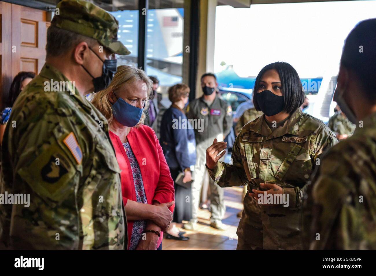 The Chairman of the Joint Chiefs of Staff U.S. Army Gen. Mark A. Milley speaks with members of the 15th Medical Group at Hickam Field on Joint Base Pearl Harbor-Hickam, Hawaii, March 4, 2021. The 15th Wing Medical Group briefed Milley on how the clinic maintains patient care while following COVID-19 precautions. Stock Photo