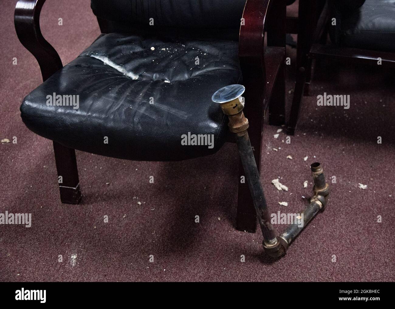 Damaged furniture and broken sprinklers sit in the Aerospace Ground