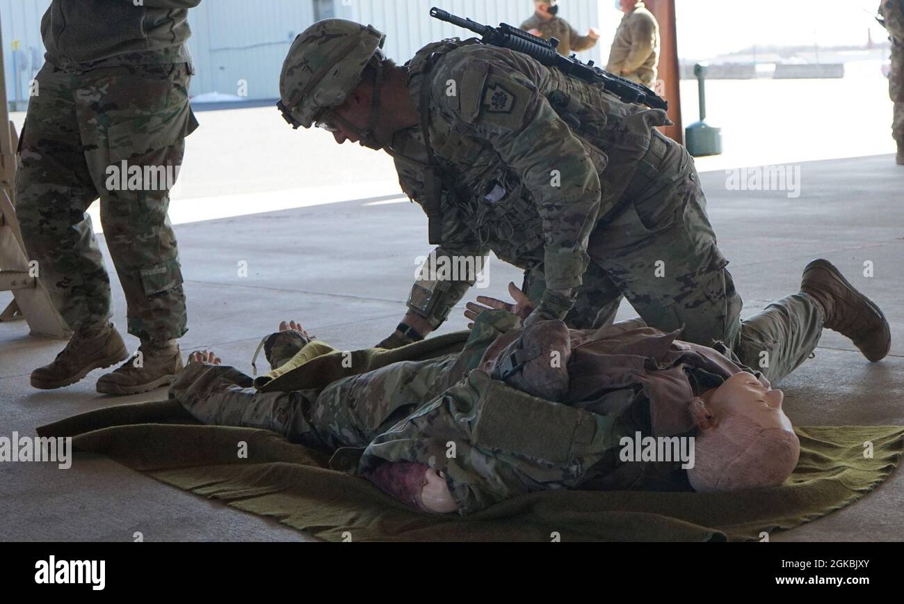 Staff Sgt. Trevor Howard, a Soldier with Pennsylvania Joint Force Headquarters, assesses a casualty during one of the medical scenarios on March 5, 2021, at Fort Indiantown Gap, Pa. The Medical events were the second challenge of the day for the participants in the Pennsylvania Army National Guard's Best Warrior Competition. Stock Photo