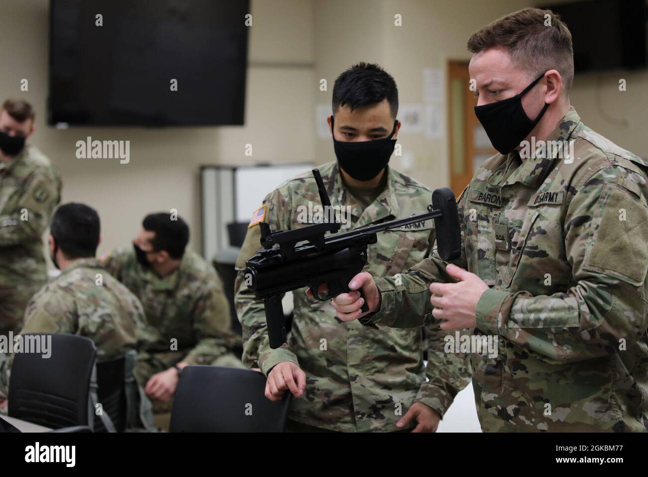 Officer Candidates Marc Solis and Alexander Baron, members of the 147th Regiment, Regional Training Institute (RTI), perform hands-on training with the M320 March 6, 2020, at the RTI in Columbus, Ohio. Officer Candidate School aims to maximize personnel capabilities with other National Guards and partnerships. (196th Mobile Public Affairs Detachment photo by Pfc. Michael Baumberger) Stock Photo