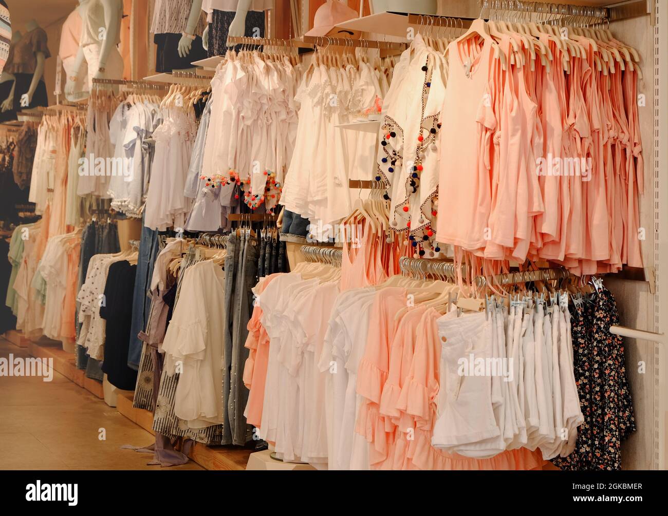 Different female clothes in modern shop Stock Photo Alamy